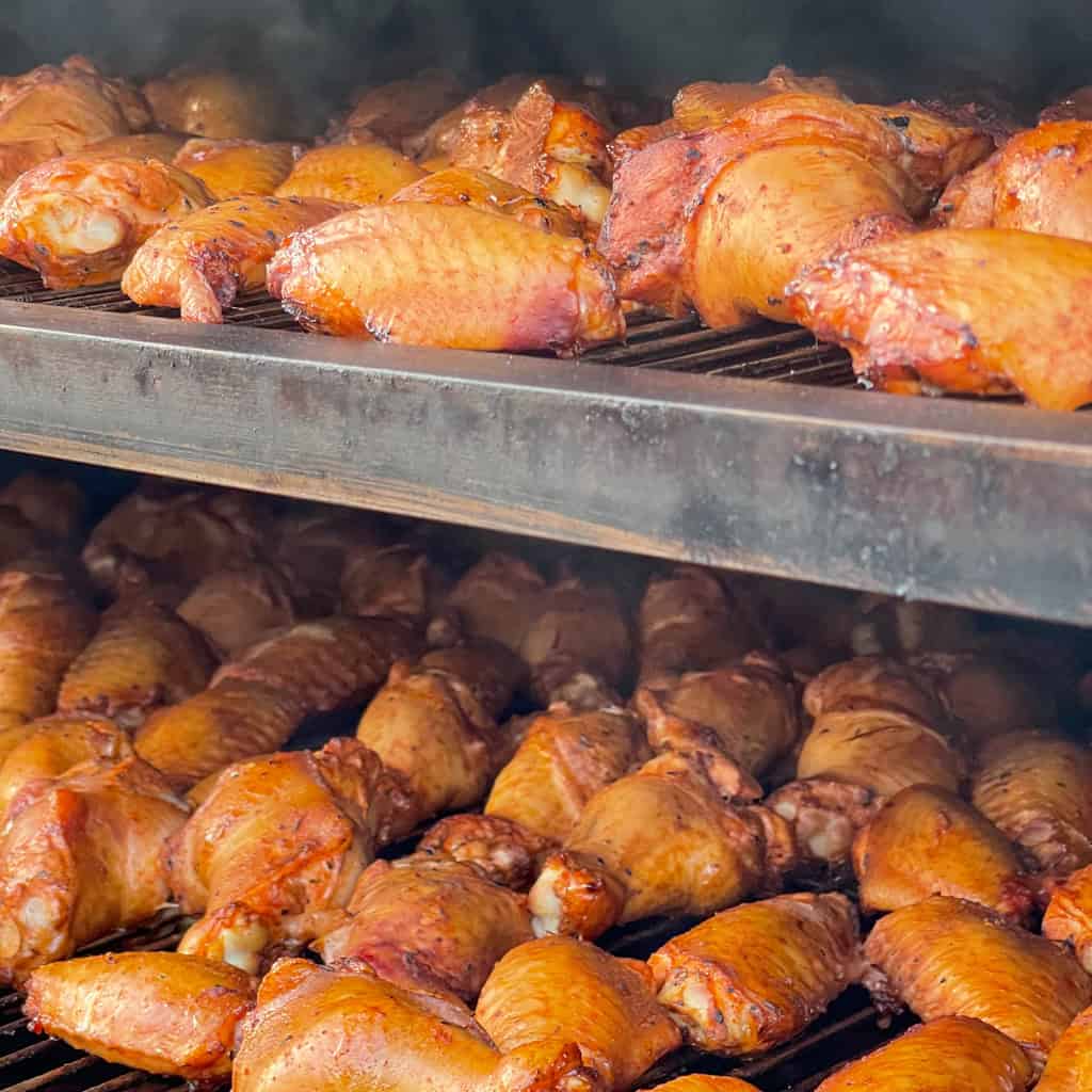 House-smoked wings still in the smoker that is served with celery and choice of blue cheese or ranch