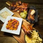 Freddy J's Full BBQ Sampler - Smoked half rack of pork ribs + sausage + quarter chicken leg + mac & cheese +baked beans + coleslaw + Caribbean sweet cornbread with cinnamon honey butter