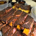 Smoked Full Rack of Ribs Combo - House-smoked full rack of pork ribs + baked beans + coleslaw + cornbread with honey butter